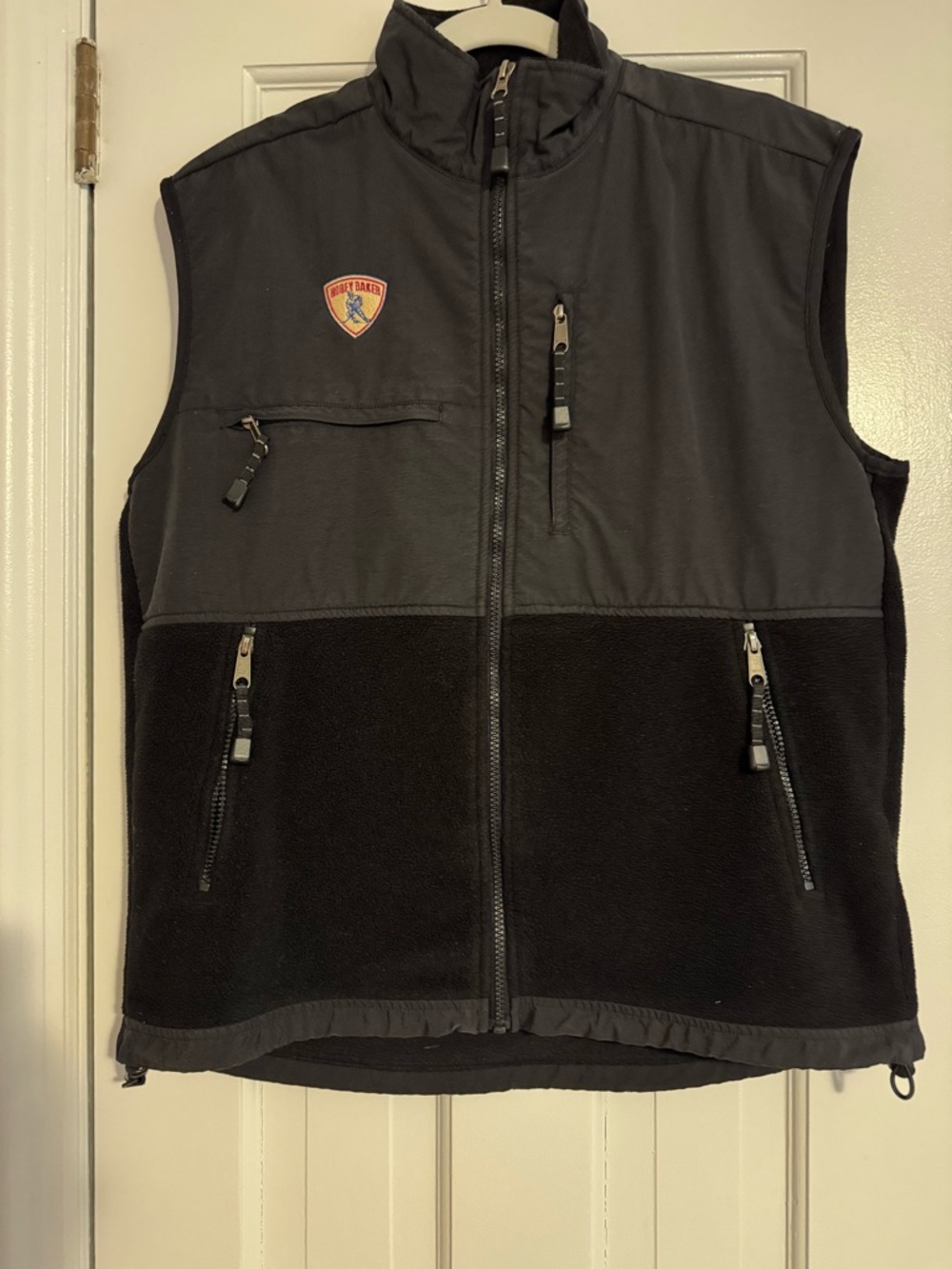 Men's Black Two-Tone Fleece Vest with Zip Pockets and Hobey Baker Patch